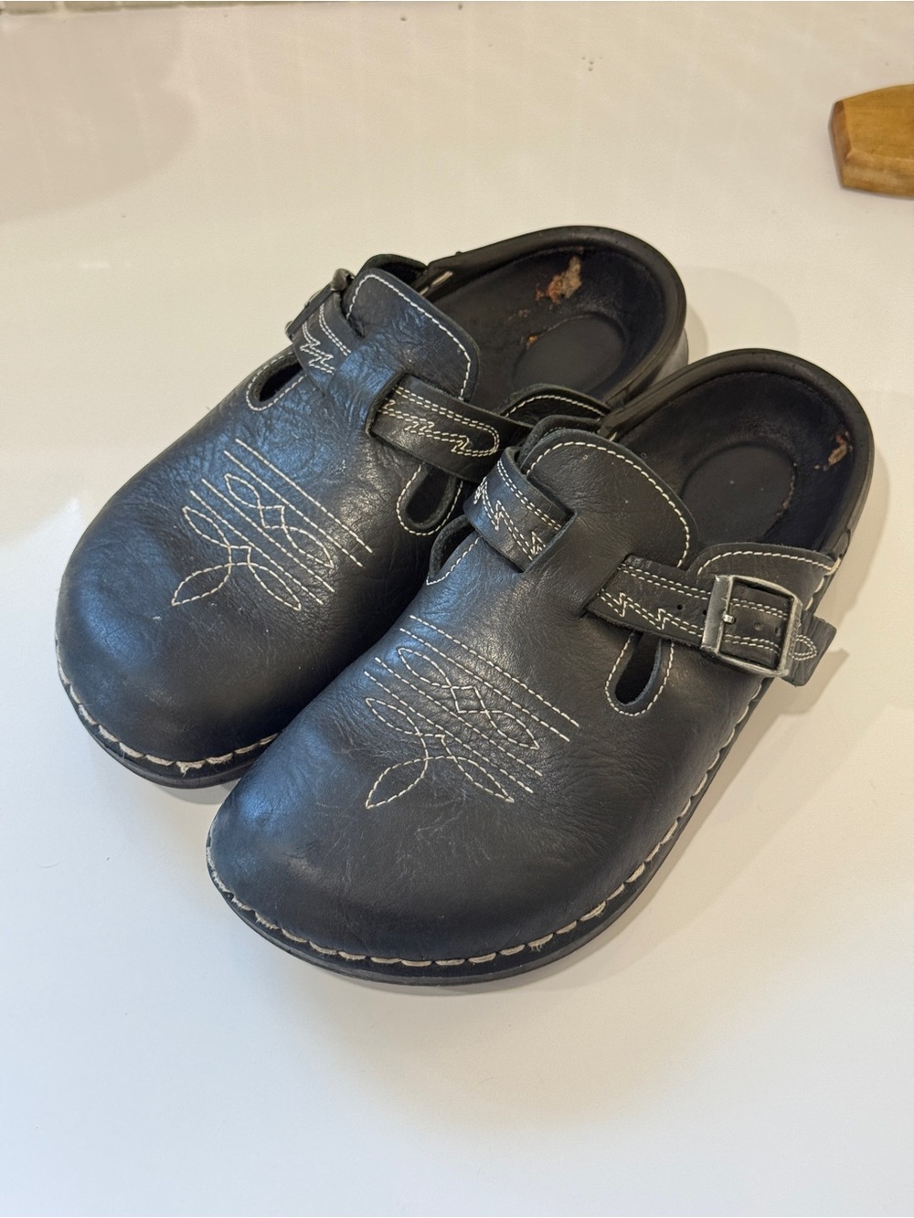 Birkenstock Black Leather Buckle Mules with White Stitching